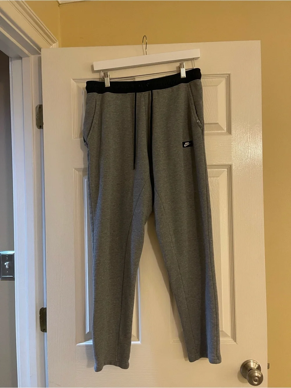 Nike Gray Sweatpants with Black Drawstring and Red Logo Tag